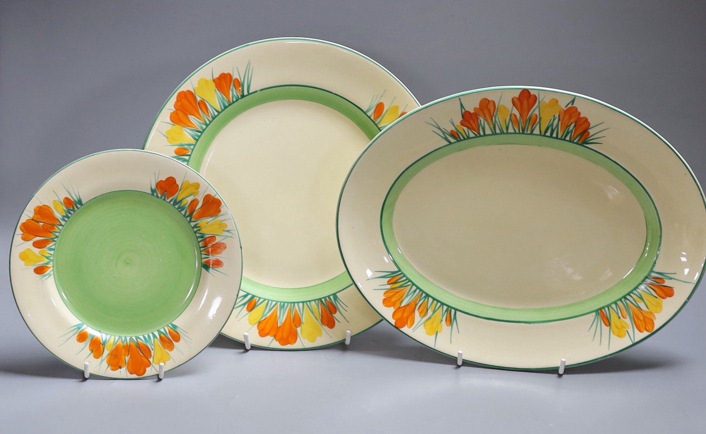 Clarice Cliff Sungleam, three crocus pattern plates